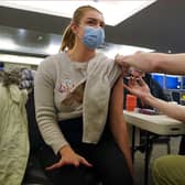 Reece Maclean is given a vaccination at a COVID-19 booster vaccination centre at Hampden Park vaccination centre in Glasgow.