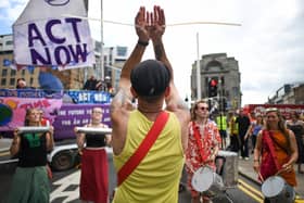 Extinction Rebellion Activists block roads near the Glasgow Tron Clock tower in 2019 (Picture: Jeff J Mitchell/Getty Images)