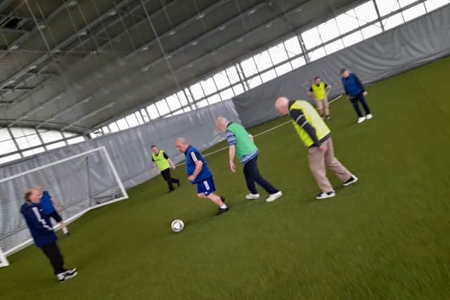 Care home residents taking part in walking football