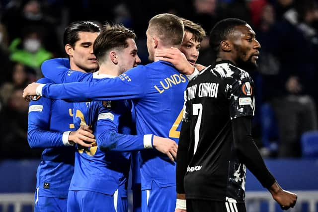 Rangers players celebrate Scott Wright's opener in the 1-1 draw in Lyon (Photo by JEFF PACHOUD/AFP via Getty Images)