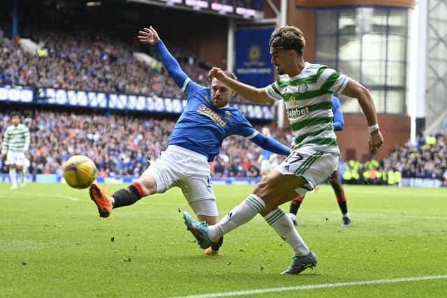 Celtic's Jota (R) and Rangers' Aaron Ramsey during the last match between the two at Ibrox.