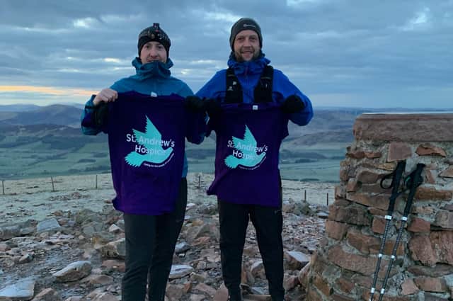 As the sunset floods the sky, the two Andy's celebrate their Everest effort at the top of Tinto.