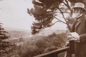 Lord Kelvin outside with notebook