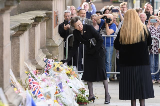The Princess Royal looks at tributes.