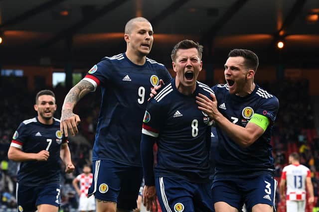 Scotland players mob Callum McGregor after his goal against Croatia (Pic by Paul Ellis/Getty Images)