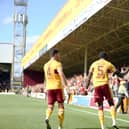 Ricki Lamie and Bevis Mugabi celebrate in front of jubilant 'Well fans after Mugabi goal