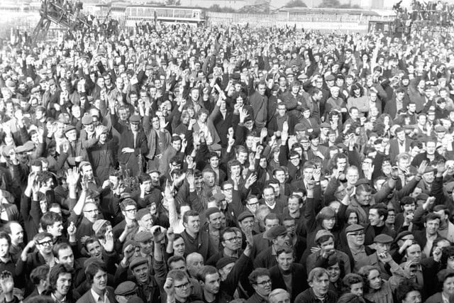 Upper Clyde Shipbuilders workers demonstrate their support of the UCS shop stewards with a show of hands at a mass meeting in Govan shipyard Glasgow in September 1971.