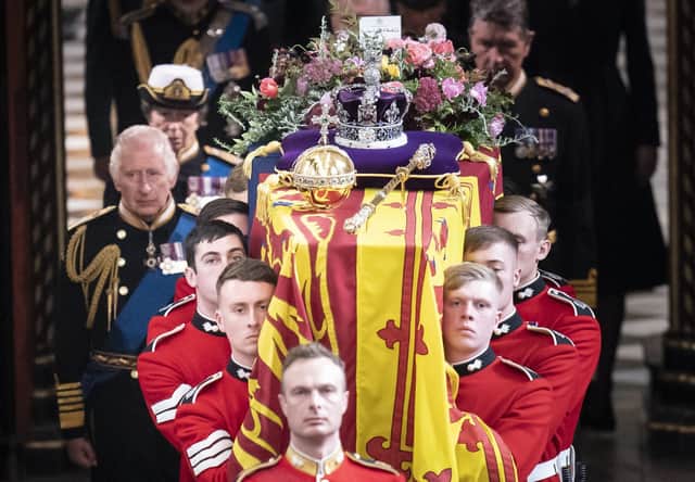 King Charles III and members of the royal family follow behind the coffin of Queen Elizabeth II, draped in the Royal Standard with the Imperial State Crown and the Sovereign's orb and sceptre, as it is carried out of Westminster Abbey after her State Funeral. Picture date: Monday September 19, 2022.See PA story FUNERAL Queen. Photo credit should read: Danny Lawson/PA Wire