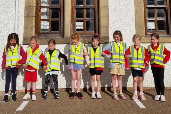 Some of the 1st Mearns Rainbows show off their new high-vis vests