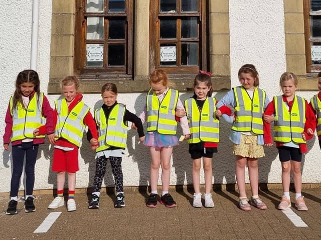 Some of the 1st Mearns Rainbows show off their new high-vis vests