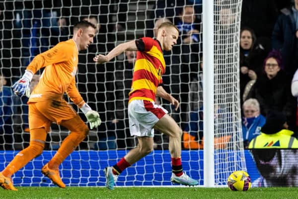 Partick's Scott Tiffoney is initially prevented from walking the ball into the net by Rangers goalkeeper Allan McGregor. (Photo by Craig Williamson / SNS Group)