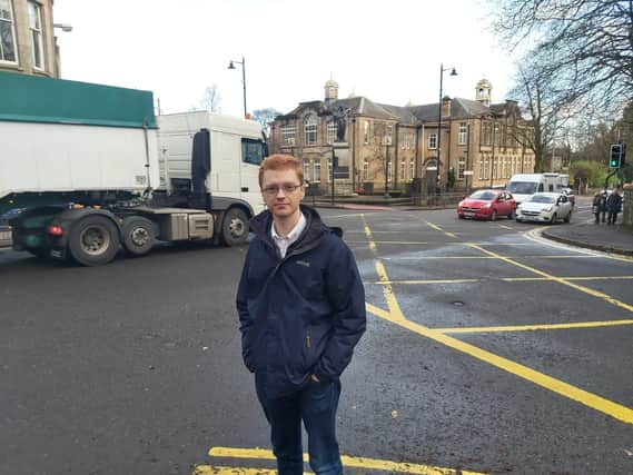 MSP Ross Greer at Bearsden Cross with the primary school in background