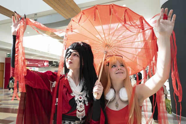 From left, Zoe McFadyen, 17, from Newton Mearns as Hua Cheng from the Heaven Official’s Blessing animation show with Jane Kerr, 17, from Eaglesham dressed as Asuka from Evangelion.