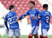 Rangers' Borna Barisic is held back after reacting to Motherwell fans.