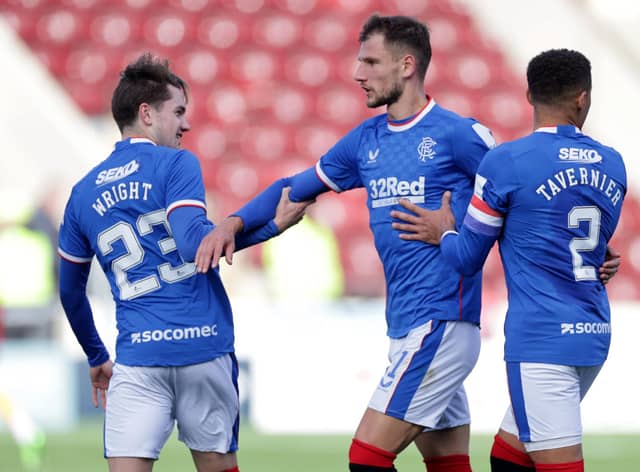 Rangers' Borna Barisic is held back after reacting to Motherwell fans.