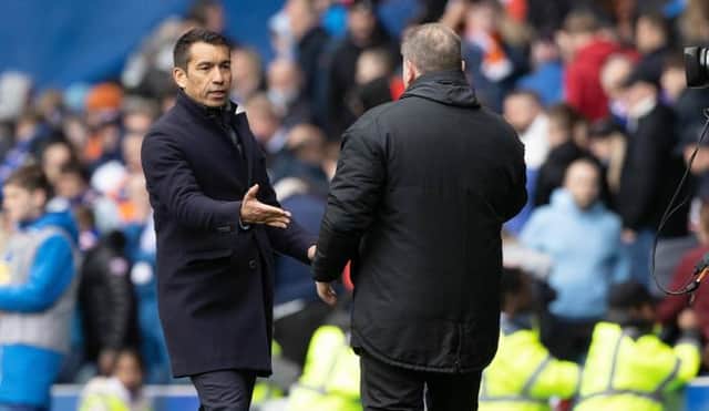 Rangers manager Giovanni van Bronckhorst with his Celtic counterpart Ange Postecoglou after the Scottish champions' lost 2-1 in the Old Firm clash at Ibrox.  (Photo by Craig Williamson / SNS Group)
