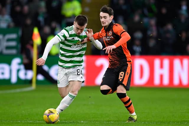 Celtic's Ben Doak is chased by Dundee United's Dylan Levitt after making his senior debut off the bench. (Photo by Rob Casey / SNS Group)