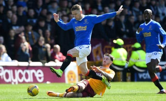 MOTHERWELL, SCOTLAND - APRIL 23: Rangers' Steven Davis (L) and Motherwell's Callum Slattery during a cinch Premiership match between Motherwell and Rangers at Fir Park, on April 23, 2022, in Motherwell, Scotland.  (Photo by Craig Foy / SNS Group)