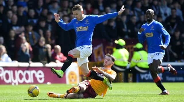MOTHERWELL, SCOTLAND - APRIL 23: Rangers' Steven Davis (L) and Motherwell's Callum Slattery during a cinch Premiership match between Motherwell and Rangers at Fir Park, on April 23, 2022, in Motherwell, Scotland. (Photo by Craig Foy / SNS Group)