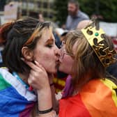 A kiss in front of the protesters.