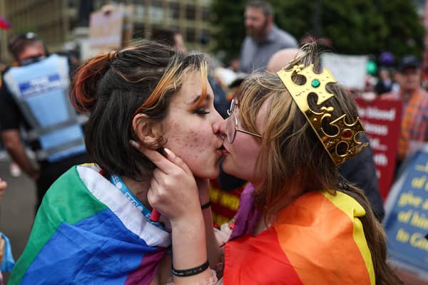 A kiss in front of the protesters.