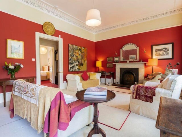 The drawing room has a feature fireplace.