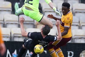 Sean Kelly gets wiped out by his own goalkeeper Max Stryjek