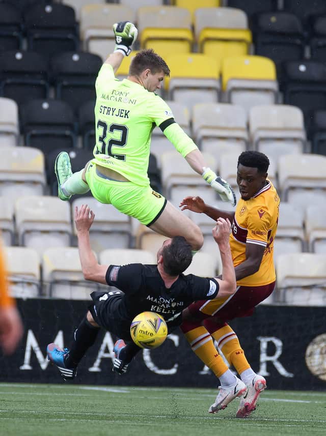 Sean Kelly gets wiped out by his own goalkeeper Max Stryjek