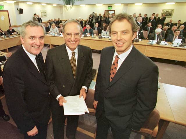 ​Bertie Ahern, Senator George Mitchell and Tony Blair after the signing of the agreement on April 10 1998