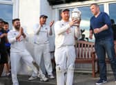 Bryan Clarke accepts the Premier Division trophy in 2019, the last year the league was contested (Pic by David Potter)