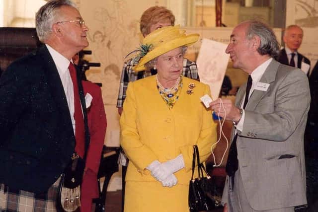 New Lanark Trust director Jim Arnold (right) presented The Queen with a mill managers’ silent monitor.