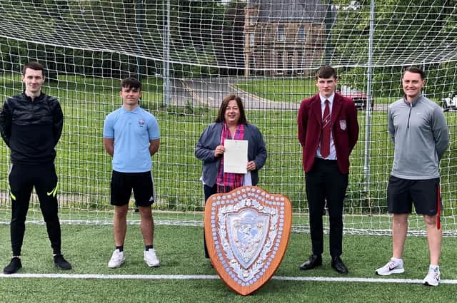Kirsten Oswald MP with St Ninian's High coaches and players (l-r) Jordan Lough, Sean Fife, Ruairidh MacDonald and Stephen McMaster