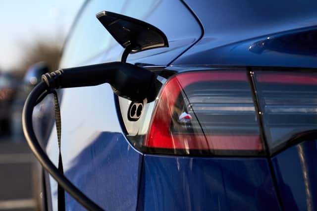 Undated file photo of an electric car being charged, as the UK Government appears less likely to meet its net zero targets since it became more transparent on its plans, its climate advisers have said.
