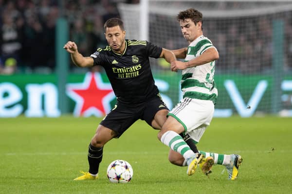 Celtic's Matt O'Riley challenges Eden Hazard of Real Madrid during the Champions League match at Parkhead on Tuesday. (Photo by Alan Harvey / SNS Group)
