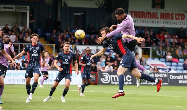 <p>Connor Goldson climbs above Ross County defender Alex Iacovitti to head Rangers 2-0 in front in Dingwall. (Photo by Alan Harvey / SNS Group)</p>