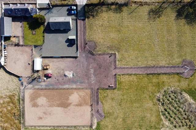 This aerial shot gives a bird's eye view of all that is on offer at the farmhouse property.
