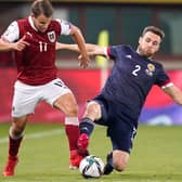 Scotland's Stephen O'Donnell and Austria's Louis Schaub vying for possession last week at the Ernst Happel Stadion in Vienna (Photo: Christian Hofer/Getty Images)