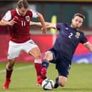 Scotland's Stephen O'Donnell and Austria's Louis Schaub vying for possession last week at the Ernst Happel Stadion in Vienna (Photo: Christian Hofer/Getty Images)