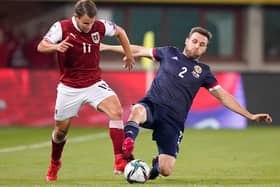 Scotland's Stephen O'Donnell and Austria's Louis Schaub vying for possession last week at the Ernst Happel Stadion in Vienna (Photo: Christian Hofer/Getty Images)