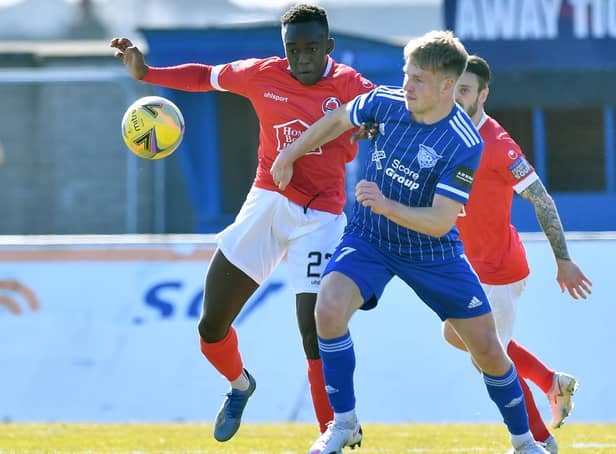 Two-goal Peterhead hero Hamish Ritchie with Clyde's Ewan Otoo (pic: Duncan Brown)