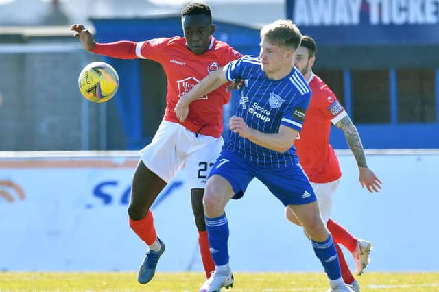 Two-goal Peterhead hero Hamish Ritchie with Clyde's Ewan Otoo (pic: Duncan Brown)
