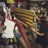 British fashion designer Mary Quant pictured selecting rolls of fabric from a fabric store and warehouse in London to create samples for a future collection in 1967. (Photo by Rolls Press/Popperfoto via Getty Images/Getty Images)