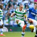 Sheffield Wednesday's josh Windass up against Fleetwood Town manager, Scott Brown, during their time at Rangers and Celtic. (Photo by Jeff J Mitchell/Getty Images)