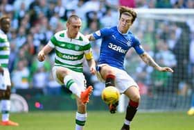 Sheffield Wednesday's josh Windass up against Fleetwood Town manager, Scott Brown, during their time at Rangers and Celtic. (Photo by Jeff J Mitchell/Getty Images)