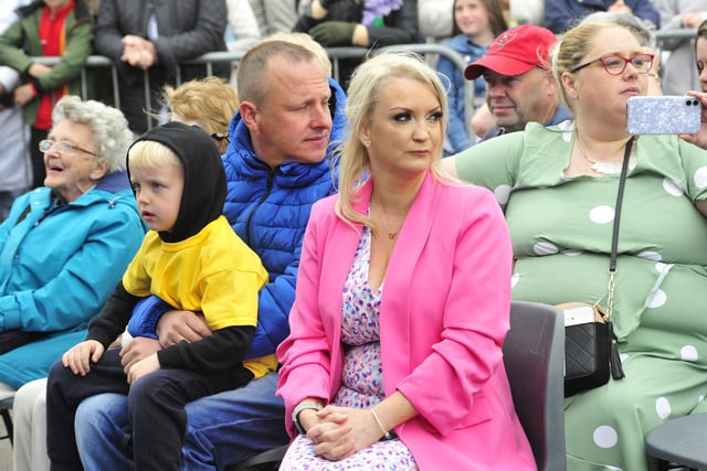 Alea Fowler's proud parents Leanne and Kevin, and wee brother Jack (7), wait anxiously for her arrival in Market Square.