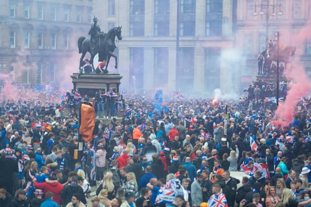 Rangers fans celebrate winning the title at George Square in Glasgow. (Picture: Euan Cherry/SNS)