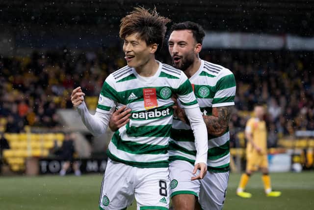 Celtic's Kyogo Furuhashi (left) celebrates his opening goal in the 3-0 win at Livingston.  (Photo by Alan Harvey / SNS Group)