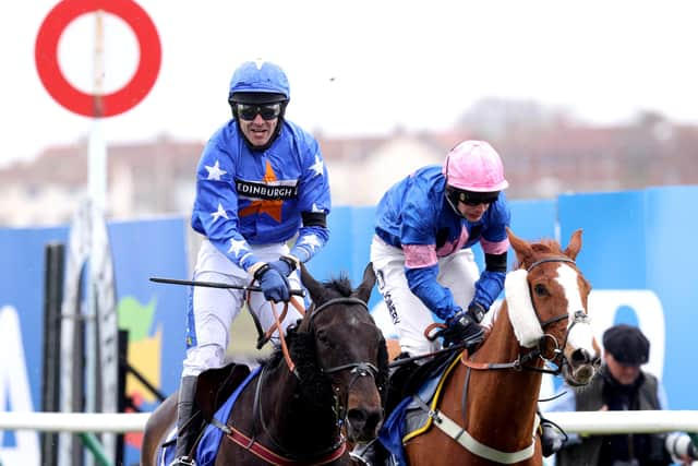 Mighty Thunder ridden by Tom Scudamore (left) wins the Coral Scottish Grand National Handicap Chase at Ayr Racecourse. (Photo by Jeff Holmes-Pool/Getty Images)