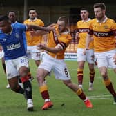 Alfredo Morelos of Rangers vies with Allan Campbell for the ball during their sides' Scottish Premiership match at Fir Park on January 17. (Photo by Ian MacNicol/Getty Images)