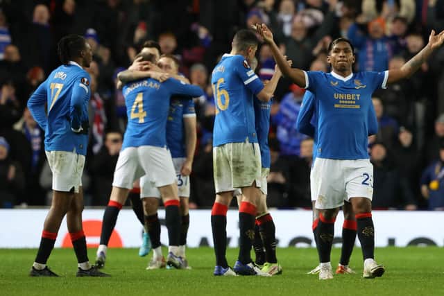 Rangers' players celebrate a famous win against Dortmund.